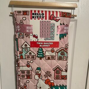 Hello Kitty Pink Holiday Village Quilted Blanket